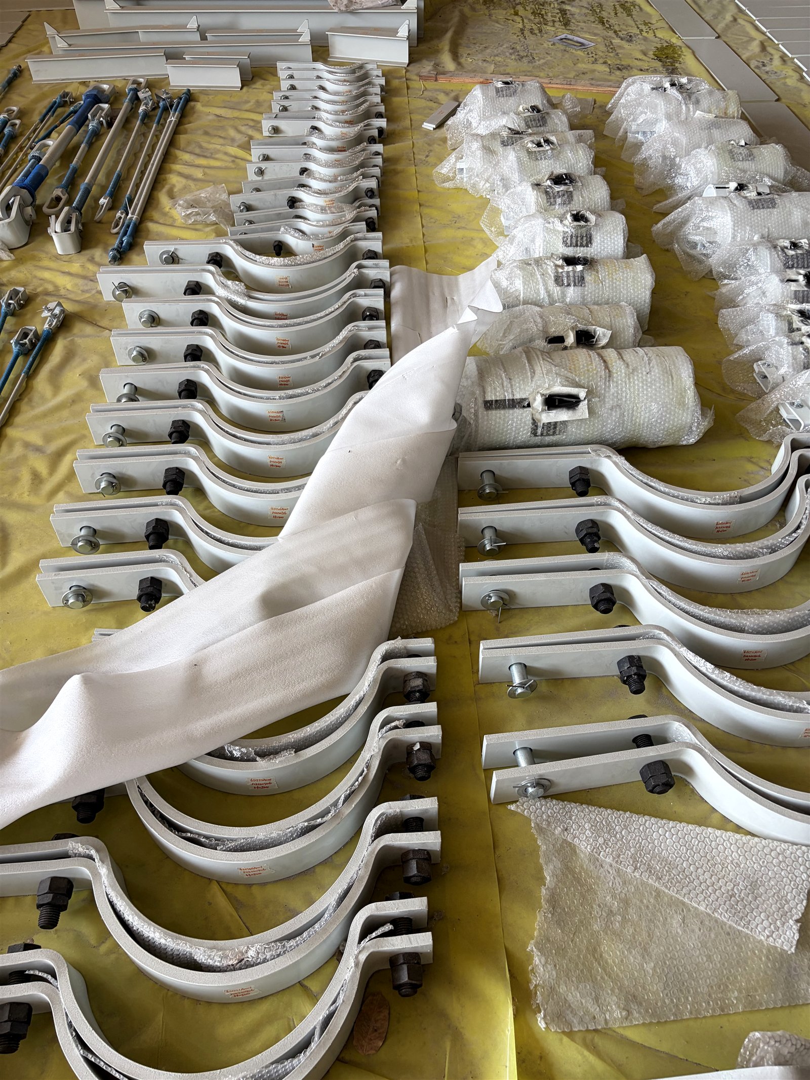 Rows of finished pipe clamps individually tagged before packing