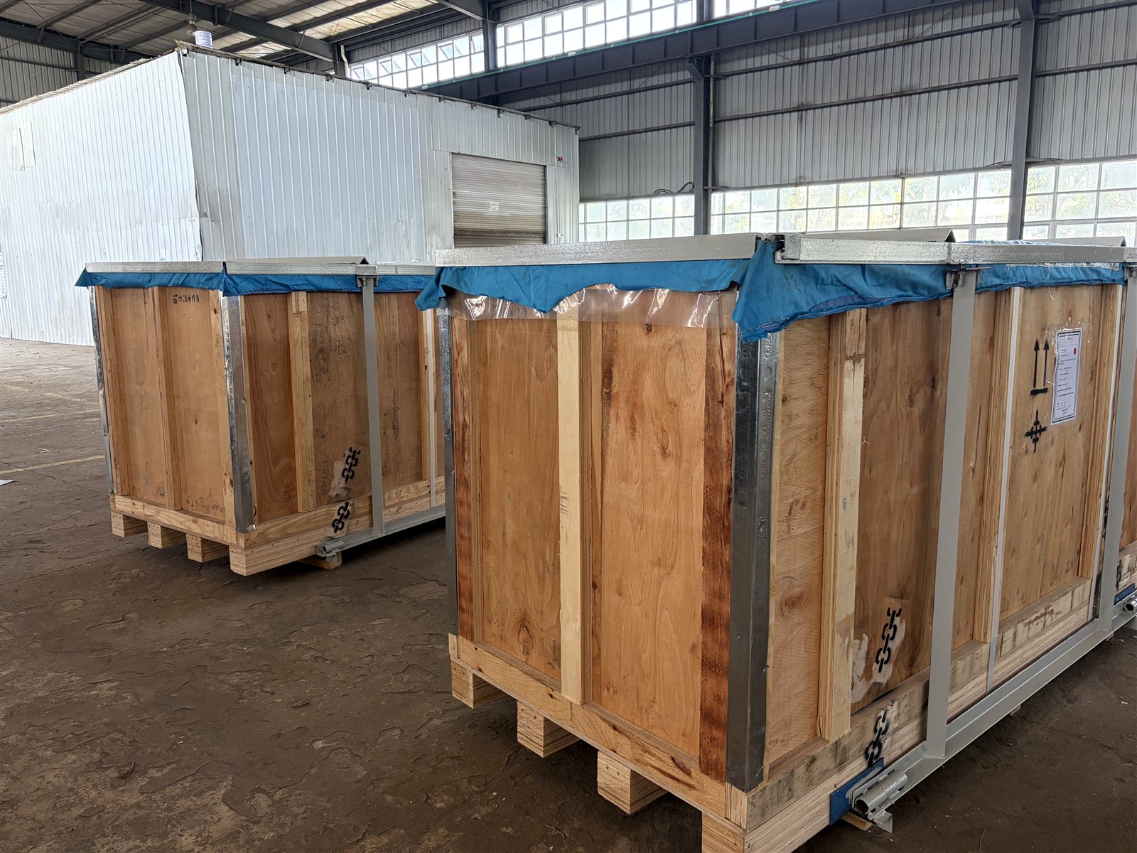 Wooden crates staged inside a workshop
