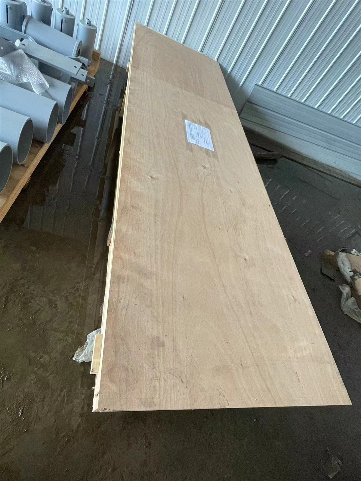 Painted high-pressure valve supports braced into an open wooden crate for shipment